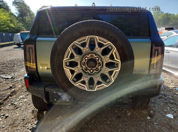 1GKB0RDC5RU100557 2024 GMC HUMMER Gray Вид ззаду