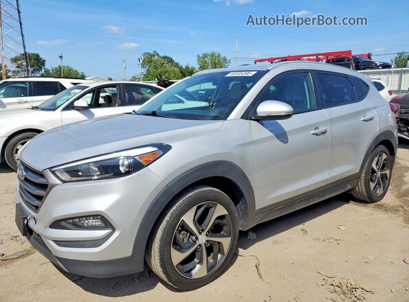 KM8J33A24GU060519 2016 HYUNDAI TUCSON Silver Trasero izquierdo