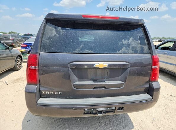 1GNSCBKC1JR135110 2018 CHEVROLET TAHOE Gray Vista interior delantera