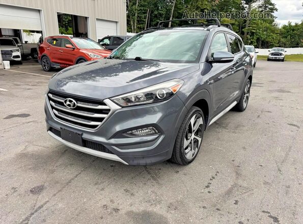 KM8J3CA24HU554624 2017 HYUNDAI TUCSON Black Rear left