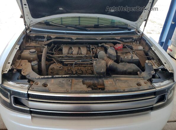 2FMHK6D86HBA13602 2017 FORD FLEX Белый Вид задней части салона