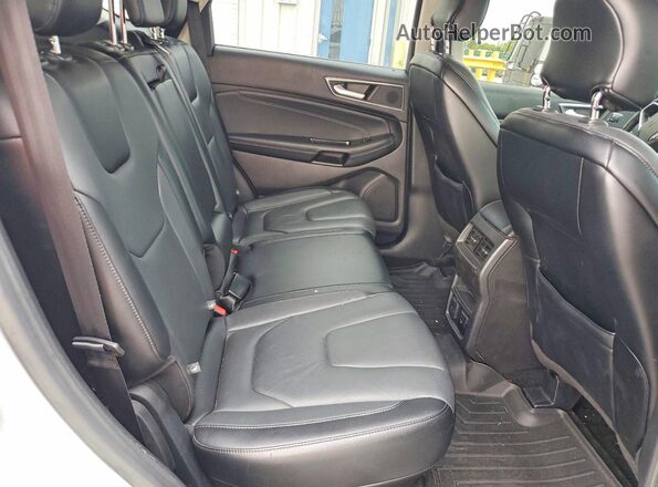 2FMPK3K97JBB43853 2018 FORD EDGE Серебряный Вид задней части салона