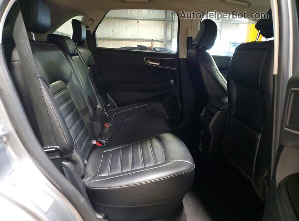 2FMPK4J95RBA81100 2024 FORD EDGE Silver Vista interior trasera