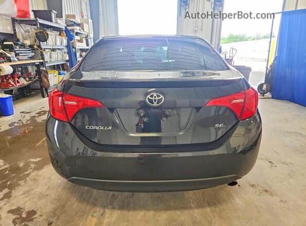 2T1BURHE3HC812668 2017 TOYOTA COROLLA Black Rear view
