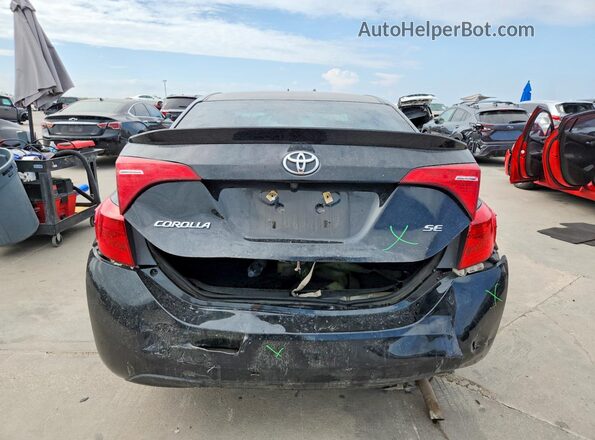 2T1BURHE4JC018252 2018 TOYOTA COROLLA Black Rear view