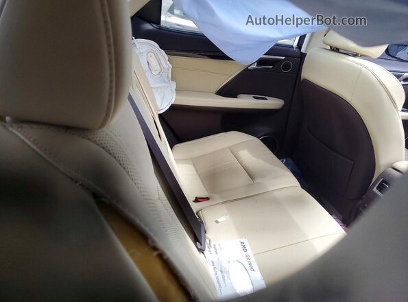 2T2BZMCA5JC158508 2018 LEXUS RX Cream Vista interior trasera