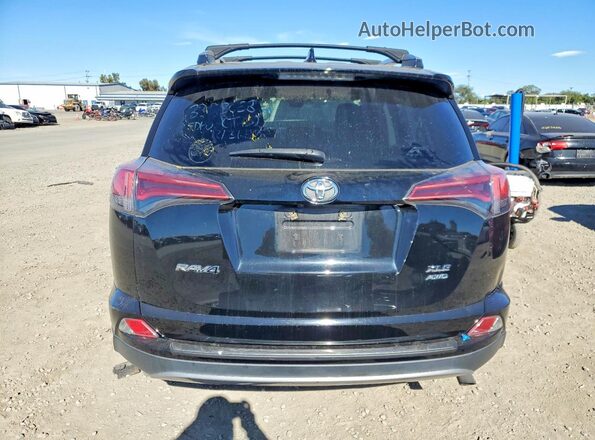 2T3RFREVXHW602507 2017 TOYOTA RAV4 Black Вид ззаду