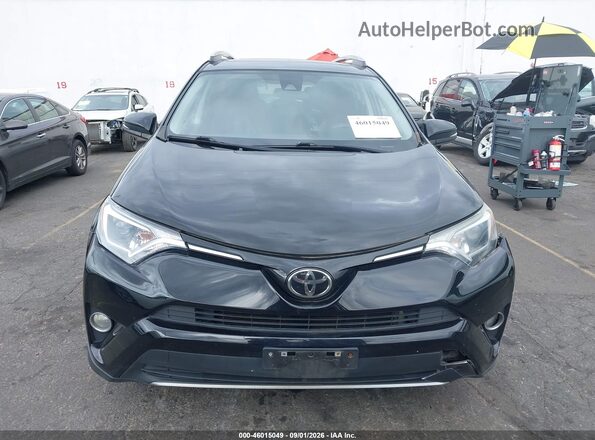 2T3RFREVXHW657801 2017 TOYOTA RAV4 Black Vista interior trasera