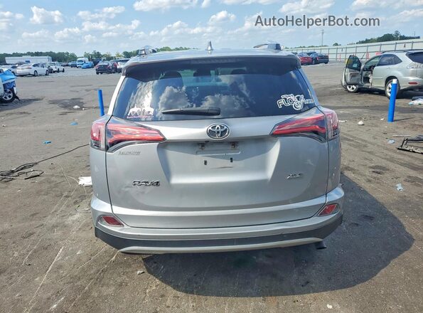 2T3WFREV3GW278673 2016 TOYOTA RAV4 Silver Widok z tyłu