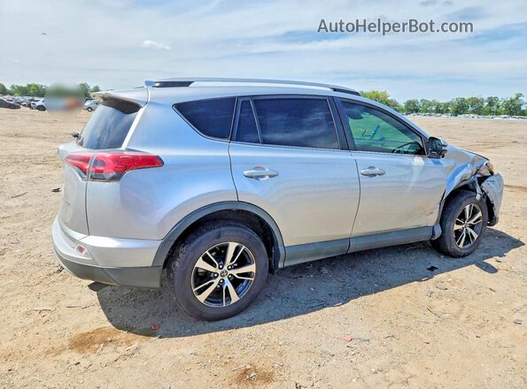 2T3WFREV9JW476701 2018 TOYOTA RAV4 Silver Rear right