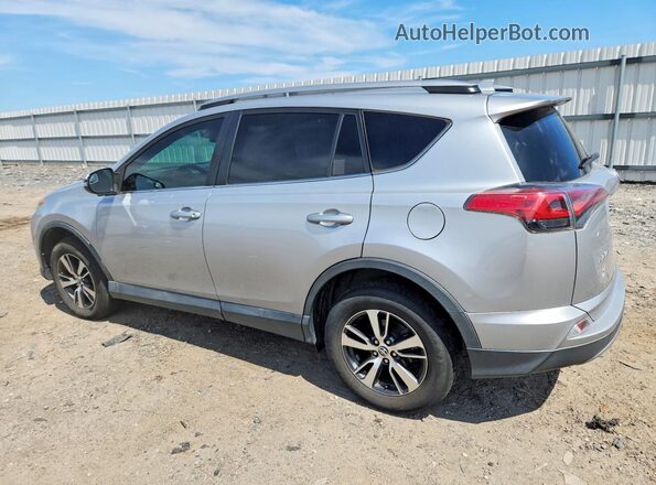 2T3WFREV9JW476701 2018 TOYOTA RAV4 Silver Rear left
