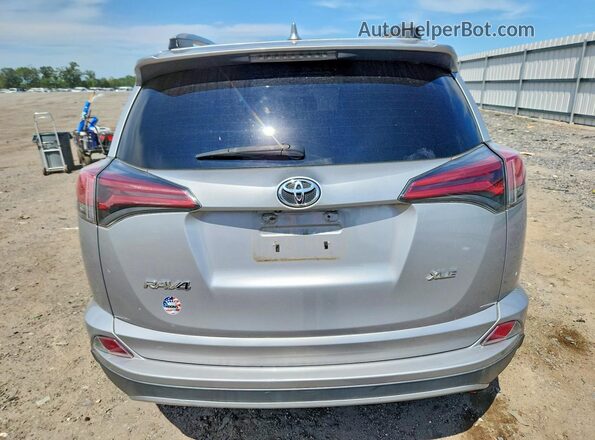 2T3WFREV9JW476701 2018 TOYOTA RAV4 Silver Rear view