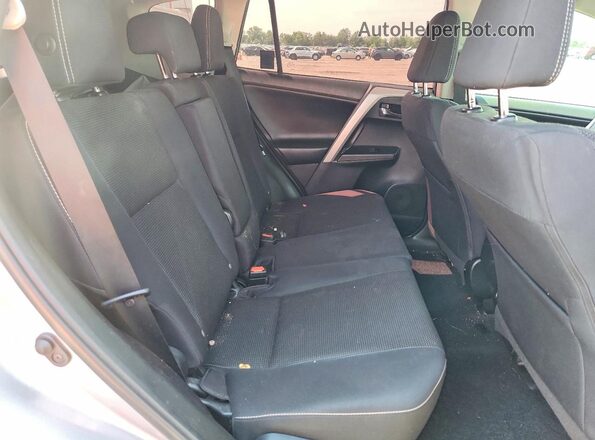 2T3WFREV9JW476701 2018 TOYOTA RAV4 Silver Rear seats view