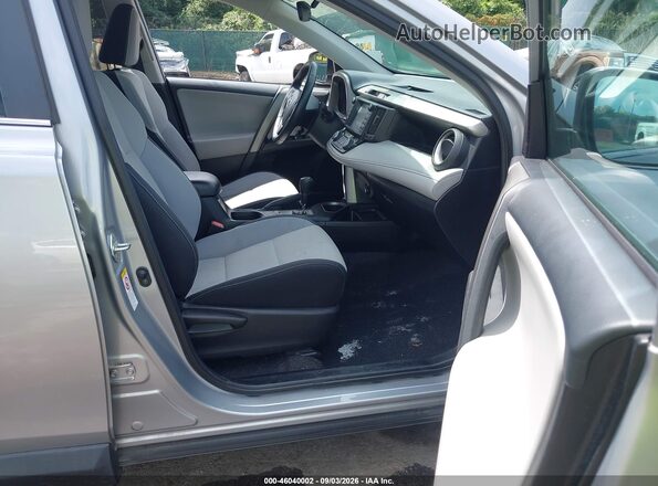 2T3WFREV9JW485852 2018 TOYOTA RAV4 Silver Front interior view