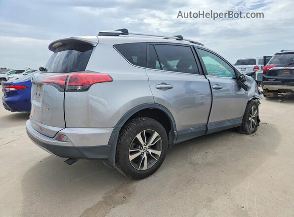2T3WFREVXJW426342 2018 TOYOTA RAV4 Серебряный Задняя правая четверть