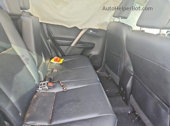 2T3YFREV1HW324012 2017 TOYOTA RAV4 Teal Widok wnętrza z tyłu
