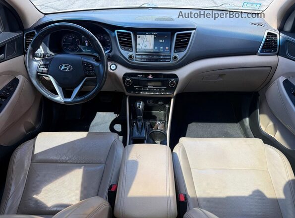 KM8J3CA22GU109278 2016 HYUNDAI TUCSON White Vista de los asientos traseros