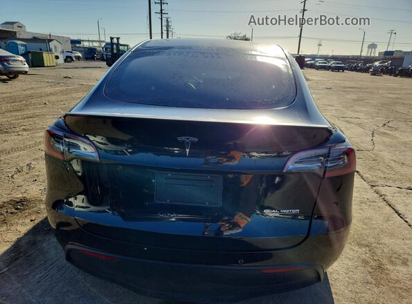 7SAYGDEF4NF490568 2022 TESLA MODEL Black Front interior view