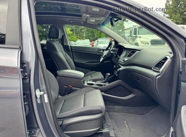 KM8J3CA24HU554624 2017 HYUNDAI TUCSON Black Rear seats view
