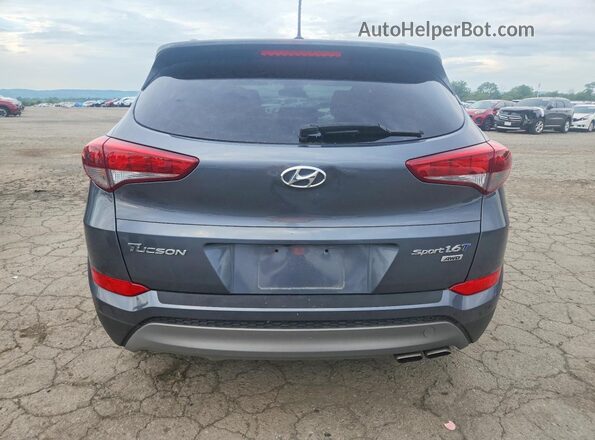 KM8J3CA22HU265032 2017 HYUNDAI TUCSON Gray წინა სალონის ხედი