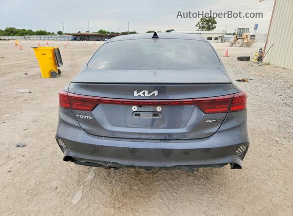 3KPF54AD7PE676404 2023 KIA FORTE Серый Вид сзади