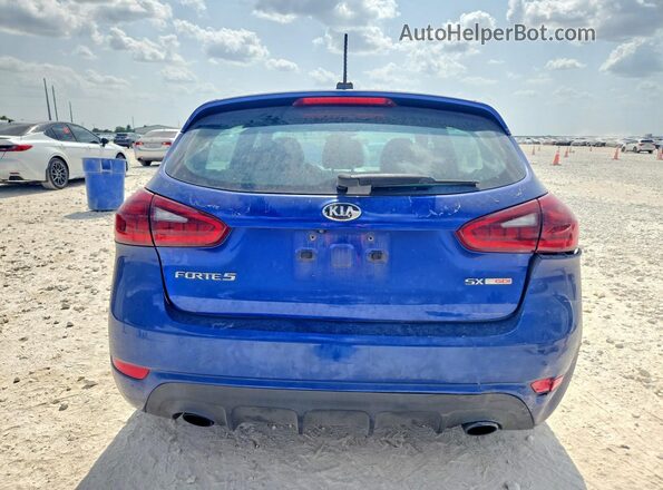3KPFN5A39HE064459 2017 KIA FORTE Blue უკანა ხედი