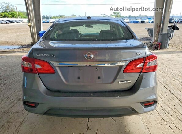 3N1AB7AP7KY413256 2019 NISSAN SENTRA Silver Вид ззаду