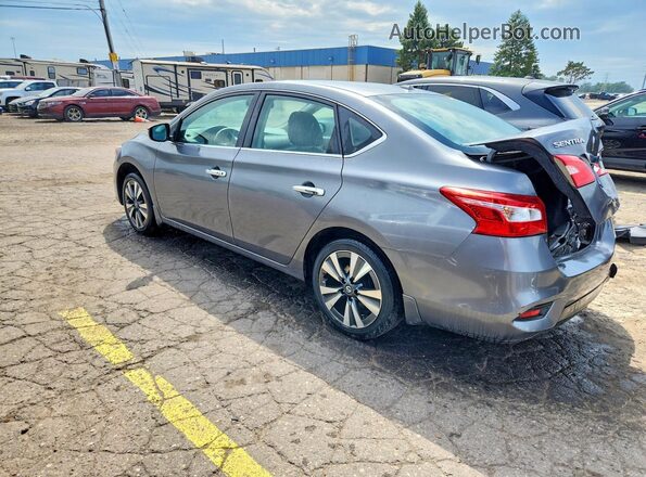 3N1AB7AP8JY257842 2018 NISSAN SENTRA Серебряный Задняя левая четверть