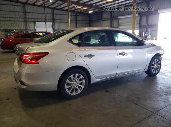 3N1AB7AP8KY357098 2019 NISSAN SENTRA Серебряный Задняя правая четверть