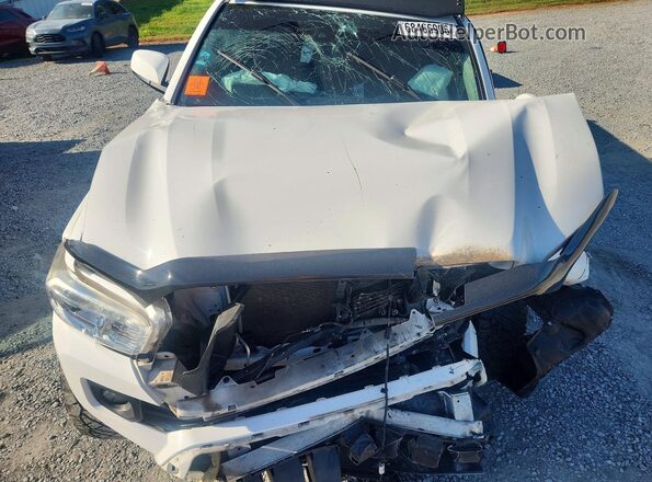3TMAZ5CN0KM085002 2019 TOYOTA TACOMA White Vista interior trasera