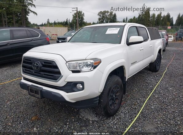 3TMDZ5BN2KM073786 2019 TOYOTA TACOMA White Vista tres cuartos delantera izquierda