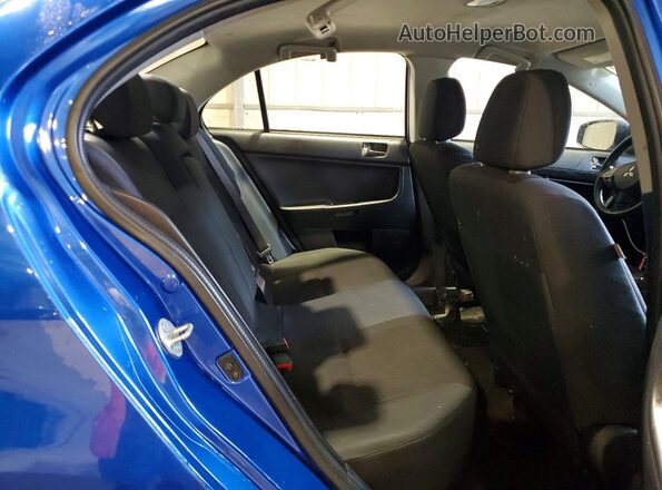 JA32V2FW4GU011134 2016 MITSUBISHI LANCER Blue Widok wnętrza z tyłu