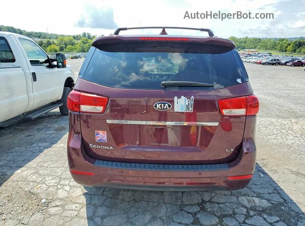 KNDMB5C11G6179217 2016 KIA SEDONA Темно-бордовый Вид салона спереди
