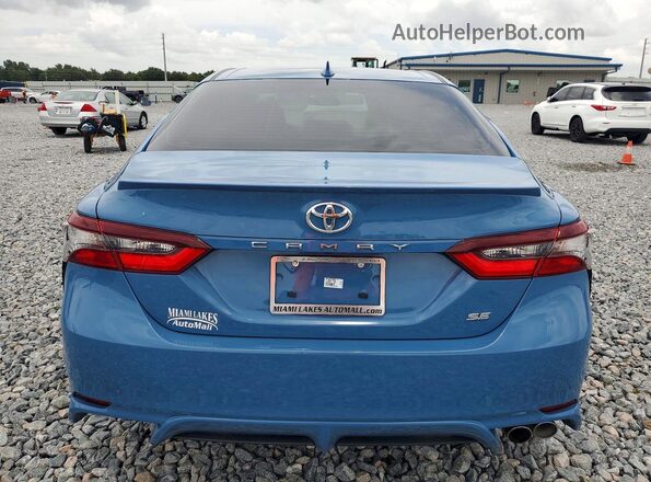 4T1G11AK2RU215575 2024 TOYOTA CAMRY Синий Вид сзади