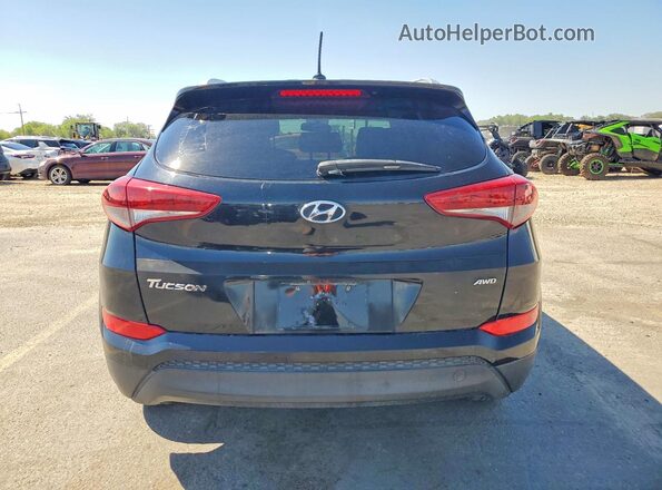 KM8J3CA45GU035632 2016 HYUNDAI TUCSON Black Front interior view