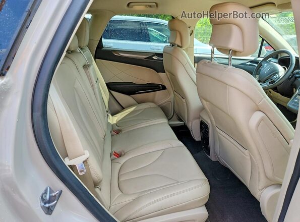 5LMCJ1D99KUL00679 2019 LINCOLN MKC Кремовый Вид задней части салона