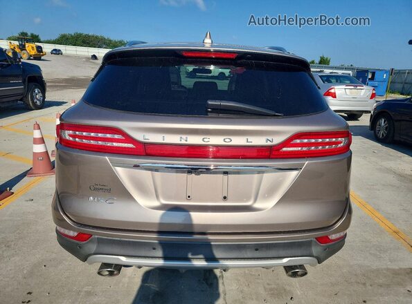 5LMCJ2C99KUL34645 2019 LINCOLN MKC Tan Vista trasera