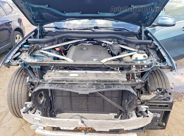 5UX23EU01S9W74128 2025 BMW X5 Blue Rear interior view