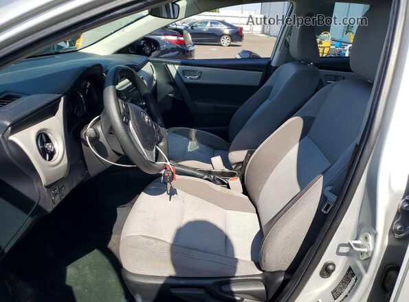 5YFBURHE1KP949860 2019 TOYOTA COROLLA Silver წინა სალონის ხედი