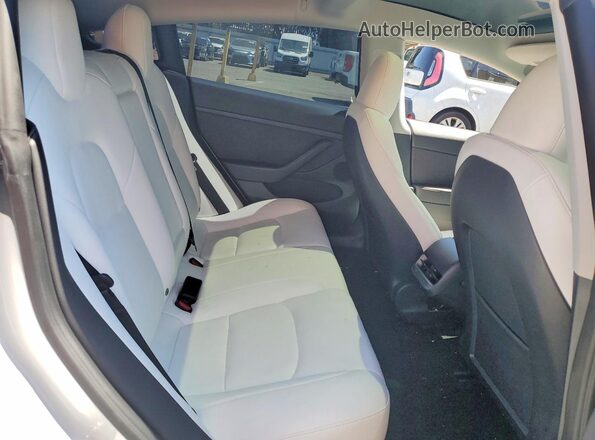 5YJ3E1EA2PF553699 2023 TESLA MODEL White Widok tylnych siedzeń