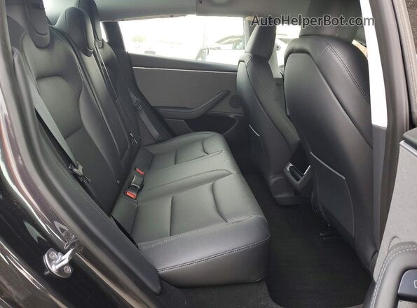 5YJ3E1EA2SF072425 2025 TESLA MODEL Black Rear seats view