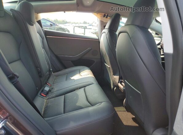 5YJ3E1EA3SF042415 2025 TESLA MODEL Gray Vista de los asientos traseros