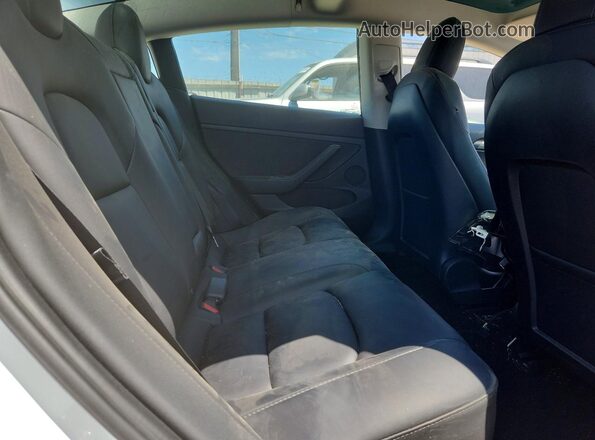 5YJ3E1EA7PF446843 2023 TESLA MODEL White Vista de los asientos traseros