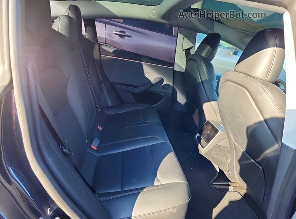 5YJ3E1EA7SF891740 2025 TESLA MODEL Gray Vista de los asientos traseros