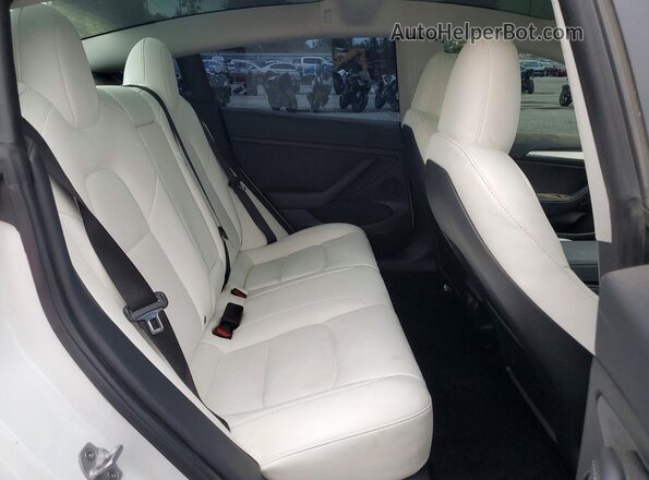 5YJ3E1EC2PF552134 2023 TESLA MODEL White Widok tylnych siedzeń