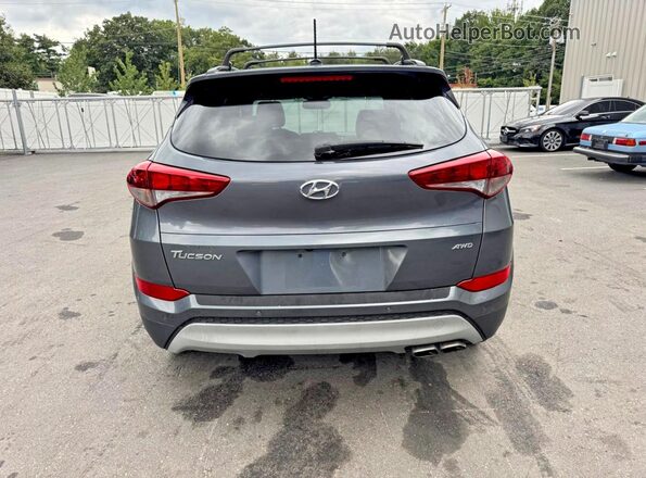 KM8J3CA24HU554624 2017 HYUNDAI TUCSON Black Rear view