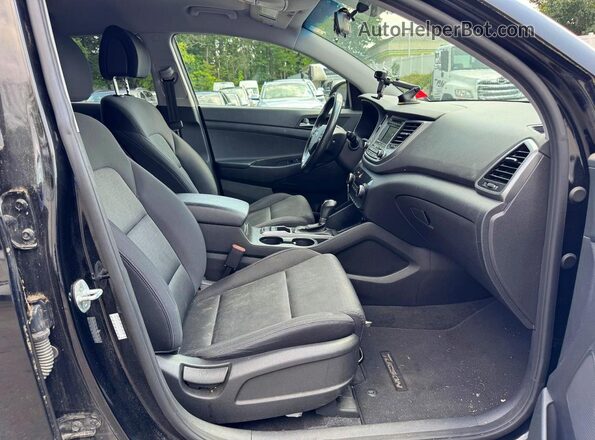 KM8J3CA25GU149712 2016 HYUNDAI TUCSON Black Widok wnętrza z tyłu