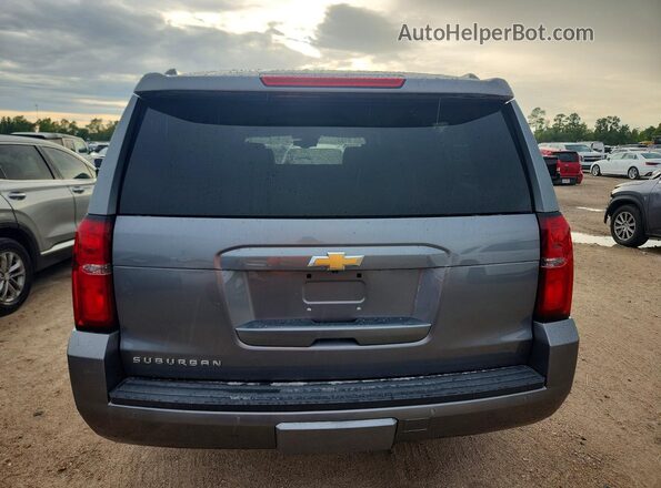 1GNSCHKC1KR262282 2019 CHEVROLET SUBURBAN Серебряный Вид салона спереди