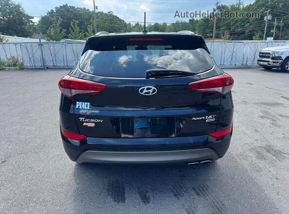 KM8J3CA25GU149712 2016 HYUNDAI TUCSON Black Widok tylnych siedzeń