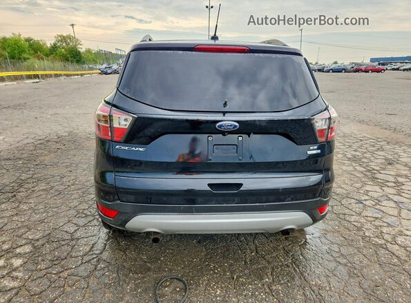 1FMCU9G9XHUA25899 2017 FORD ESCAPE Black Front interior view